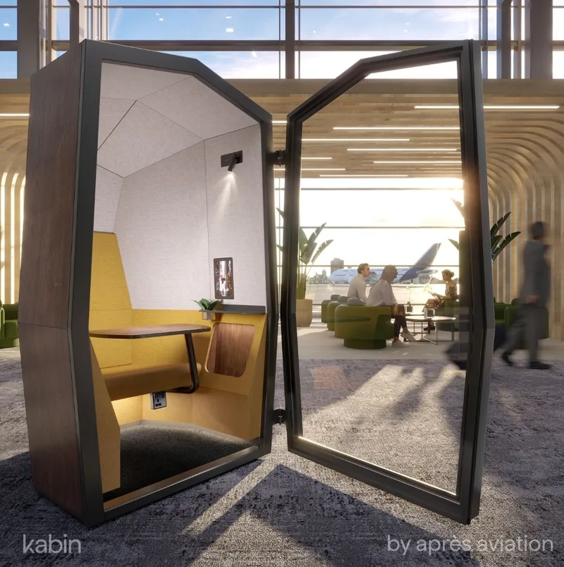 Vista interior de Kabin de Après Aviation que muestra asientos ergonómicos y una pantalla táctil integrada para trabajar de forma segura en el aeropuerto.